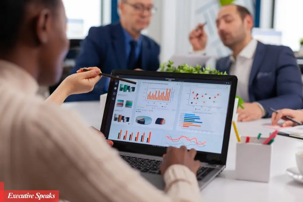 Business team reviewing sales revenue growth strategies on a digital dashboard