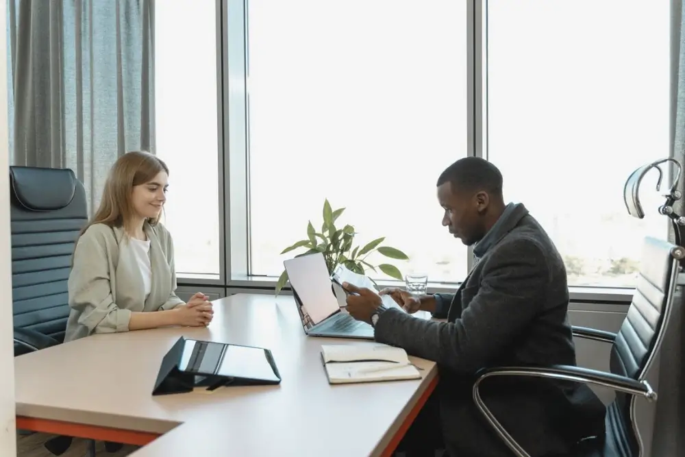 CEO conducting a job interview evaluating candidate traits and leadership potential