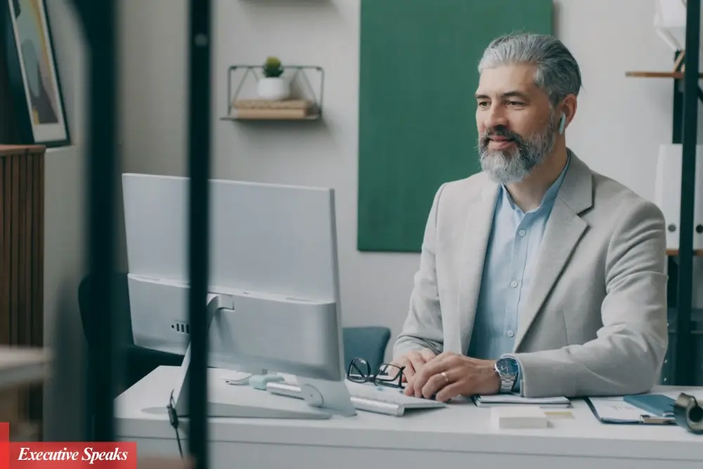 CEO sitting at a desk reviewing performance metrics and planning the company's strategic goals