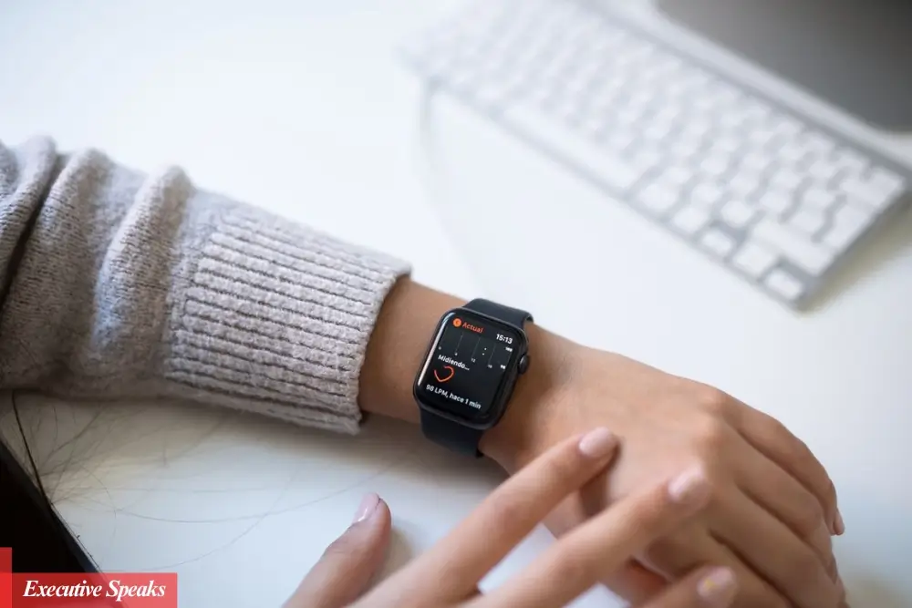 Doctor reviewing patient health data collected from a wearable health monitoring device