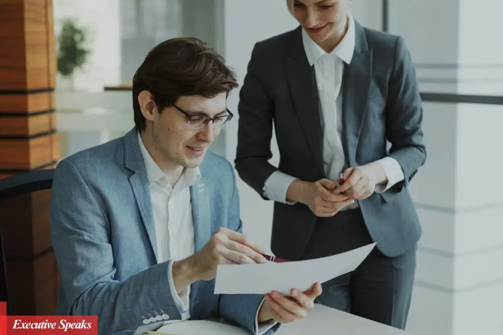 Manager giving constructive feedback to an employee in a professional office setting