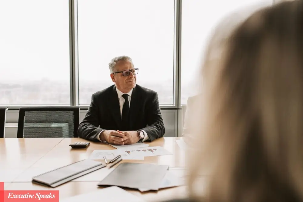 New CEO reviewing business strategy documents during first 90 days of leadership
