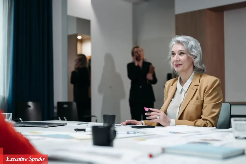 Woman entrepreneur confidently leading a business meeting, overcoming gender challenges in the workplace