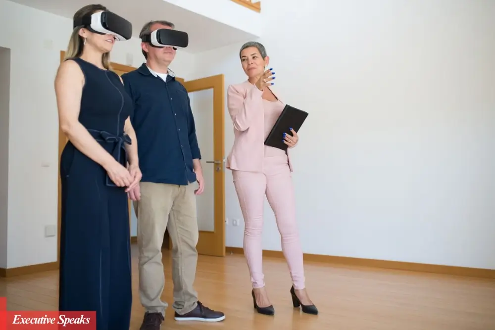Buyer viewing a virtual 3D home tour on a laptop while browsing real estate listings remotely