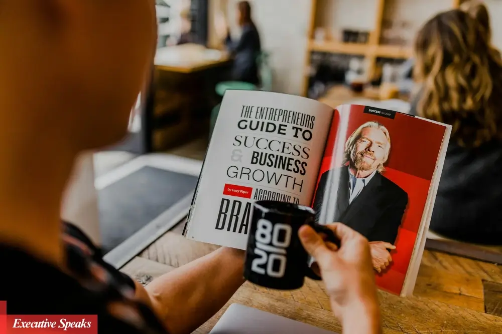 Business founder being interviewed for a feature in a top industry magazine