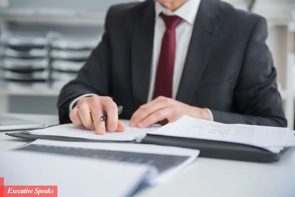 Government official reviewing sensitive compartmented information access control documents