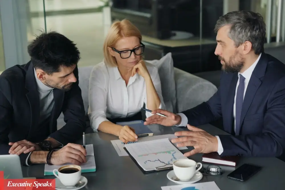 Experienced fractional executive leading a business strategy meeting with company leadership team